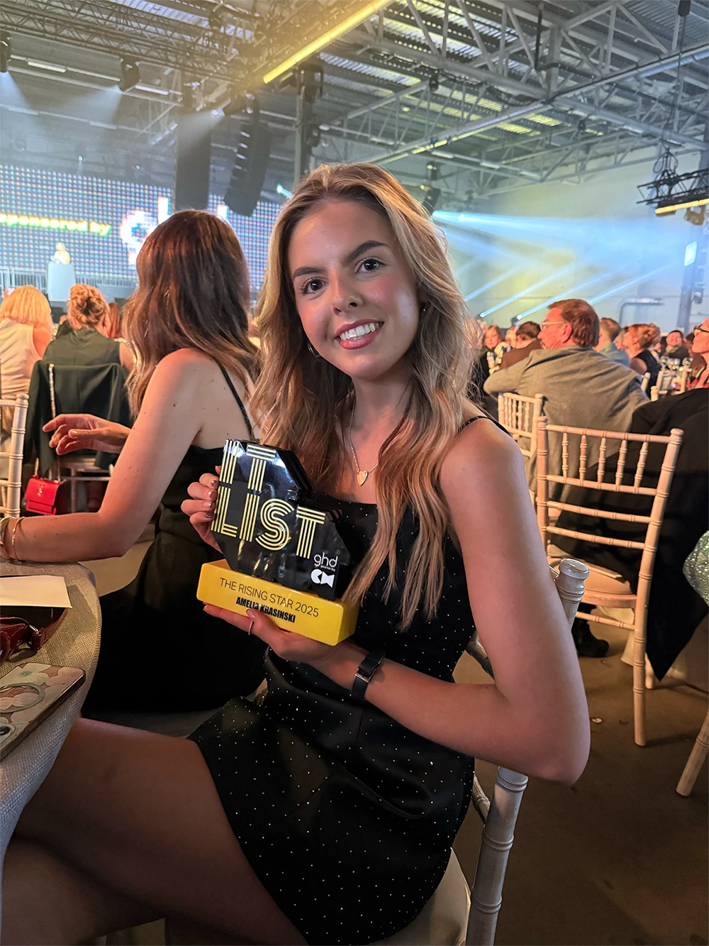 Amelia Accepting Rising Star Award After Her Successful Hair Styling Apprenticeship